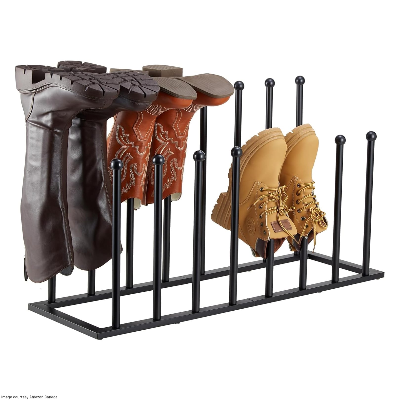 metal peg rack with three pairs of boots upside down on the pegs